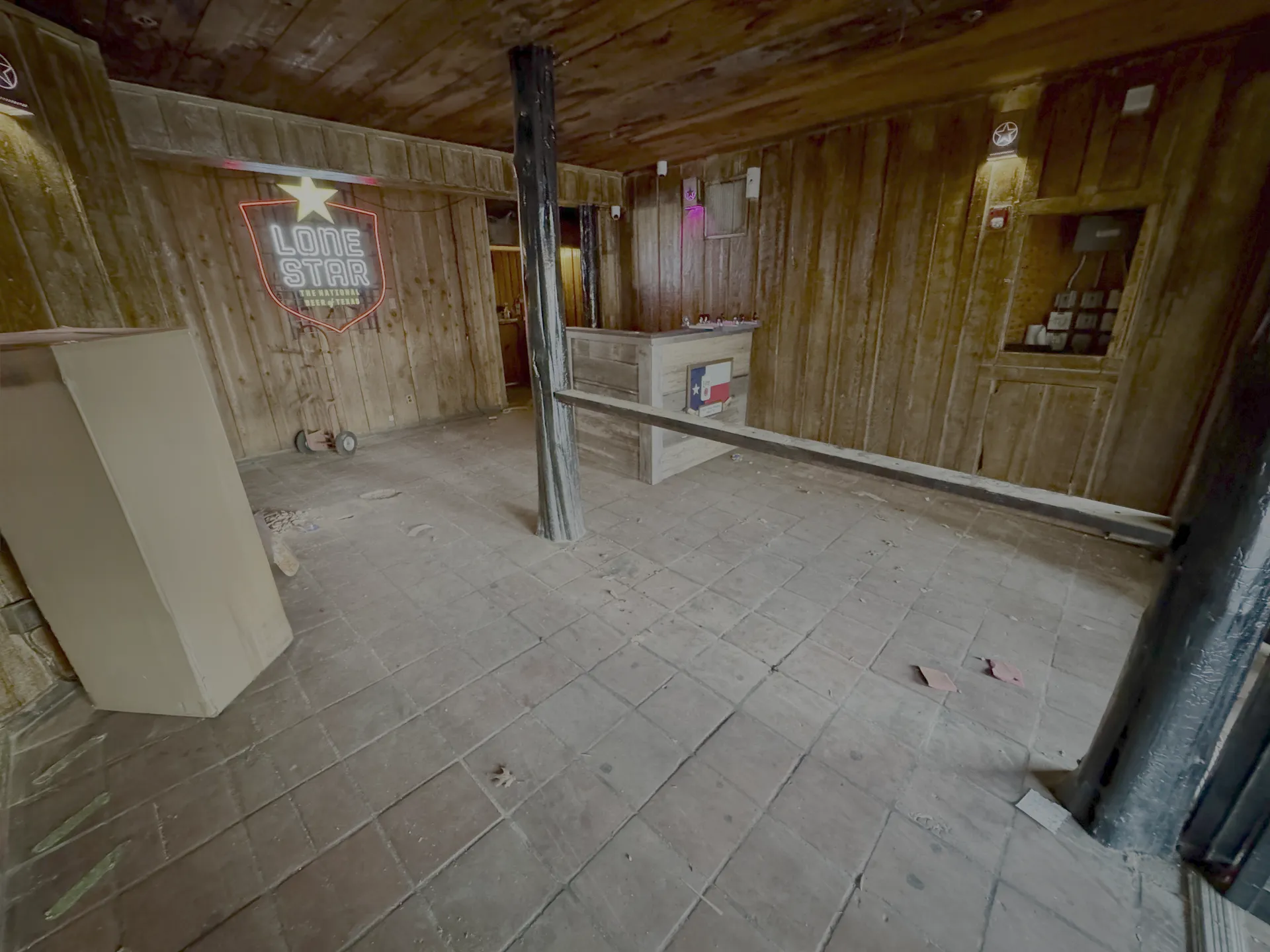 Before: bare concrete floor at Hurricane Harry's